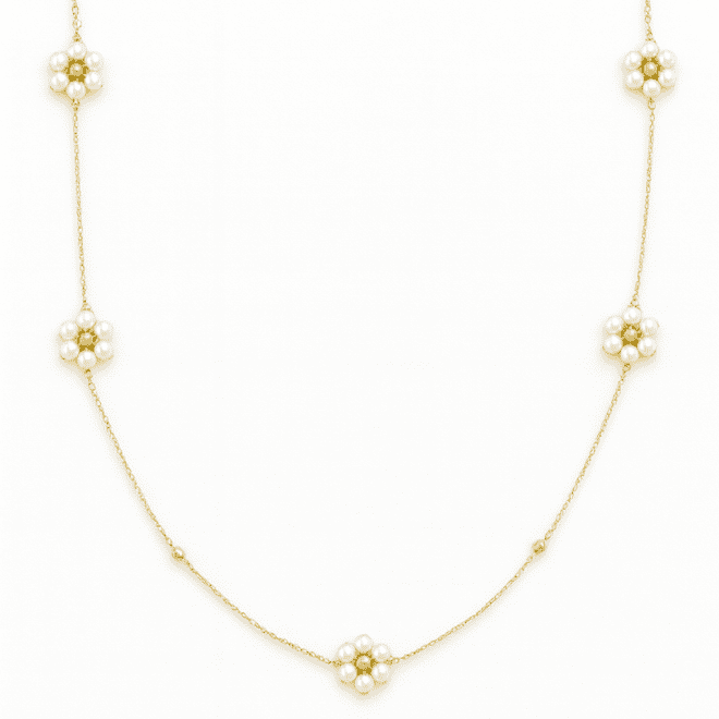 18k yellow gold children’s necklace with Bahraini natural pearls in a floral design.