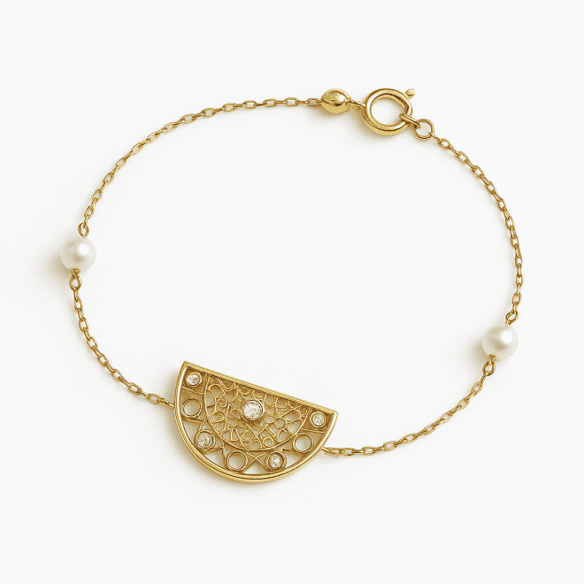 18k yellow gold bracelet with mother of pearl, zircon stones and pearls in a half-moon design.