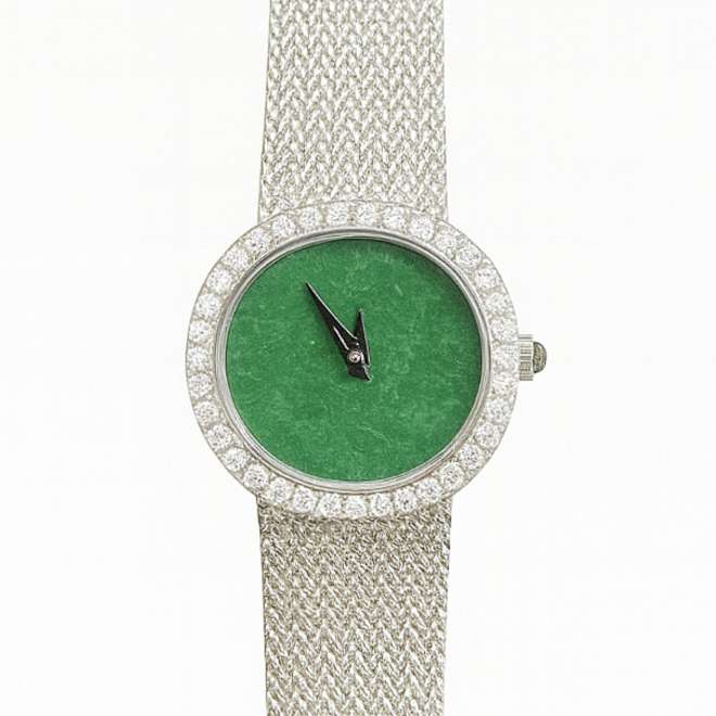 Vintage women’s watch with natural jade dial and diamond bezel on a white gold mesh bracelet.