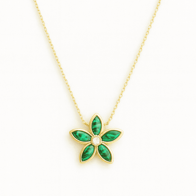 18k yellow gold reversible necklace with malachite, mother of pearl, and natural diamonds in a floral pendant design