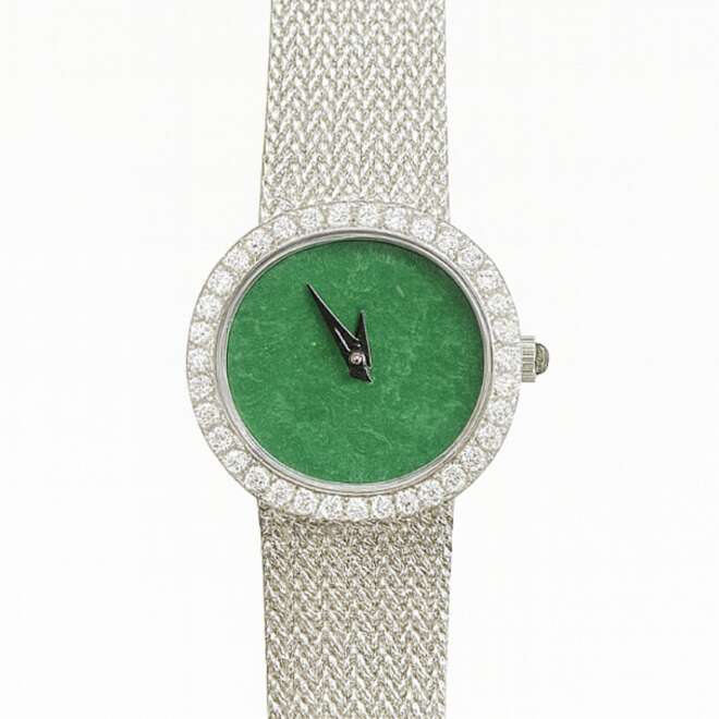 Vintage women’s watch with natural jade dial and diamond bezel on a white gold mesh bracelet.