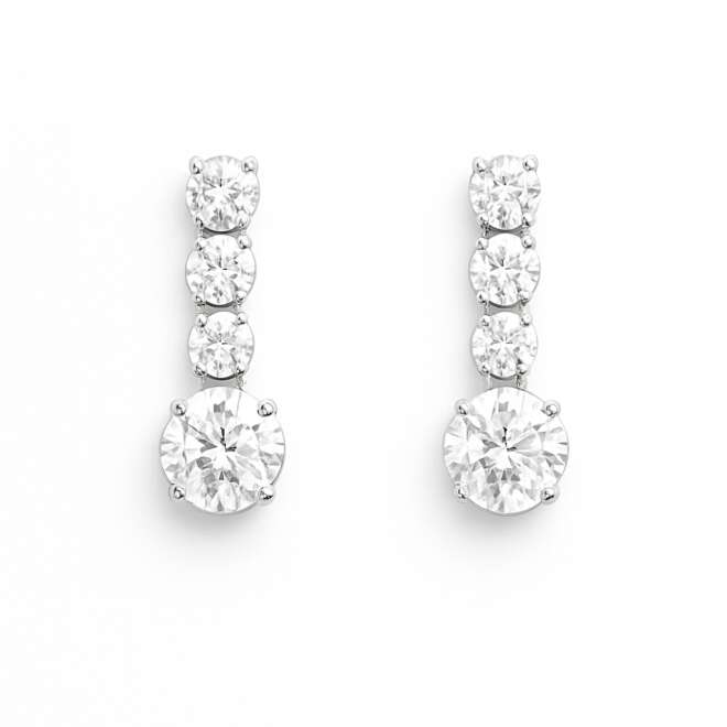 Discover timeless elegance with these diamond drop earrings, expertly crafted in 18K white gold with a total weight of 1.69 grams and adorned with 0.75 carats of natural diamonds. A refined vertical row of three round brilliant-cut diamonds leads to a larger round diamond at the base, creating a graceful drop silhouette with exceptional sparkle and sophistication. Perfect for formal events, gifting, or adding a luxurious finishing touch to everyday looks, this design blends classic beauty with modern minimalism. We provide worldwide shipping from Dubai using highly secure, insured, and discreet delivery services, ensuring your jewelry arrives safely and promptly
