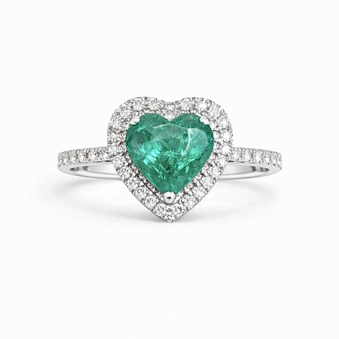 Heart Shape Zambian Emerald Ring With Natural Diamonds Set In 18K White Gold On A Clean White Background
