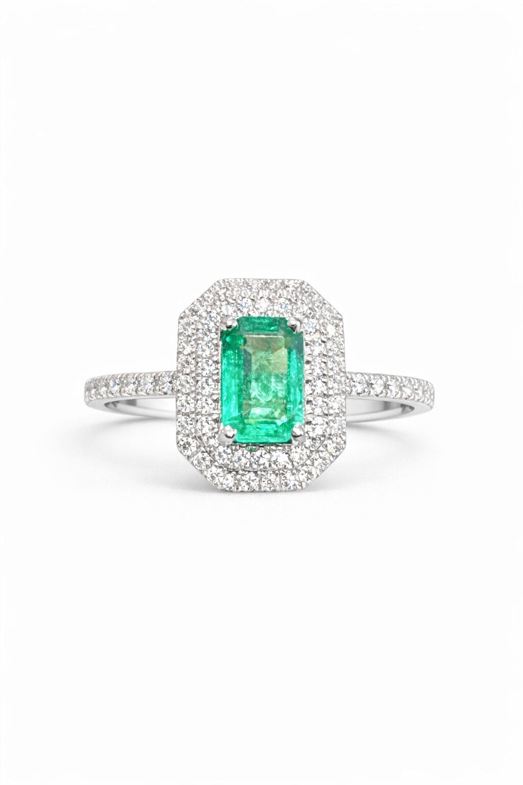 Natural Zambian Emerald Halo Ring In 18K White Gold 1 18K White Gold Ring Featuring Natural Zambian Emerald In Baguette Cut With Natural Diamond Halo On White Background